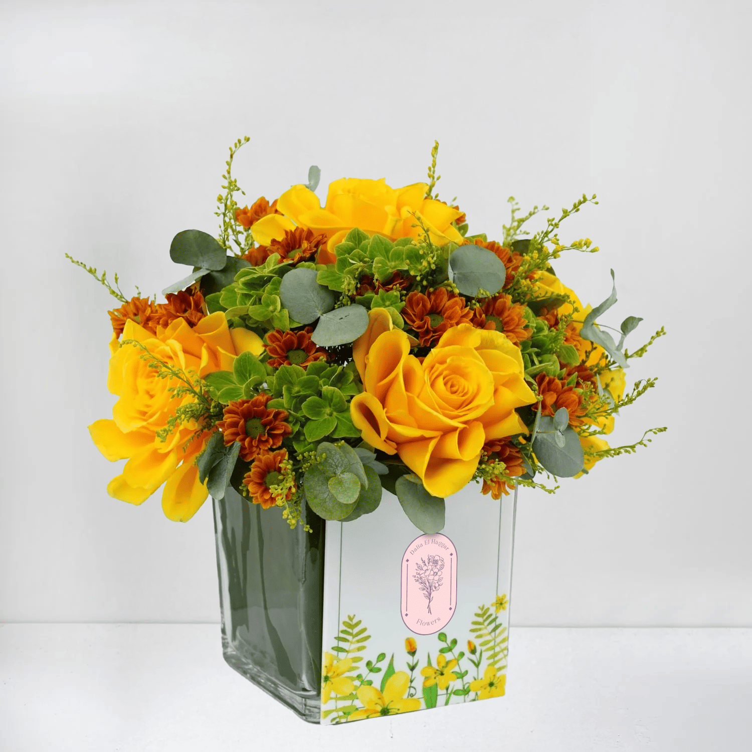 Yellow Roses, Orange Blooms & Greens in Vase