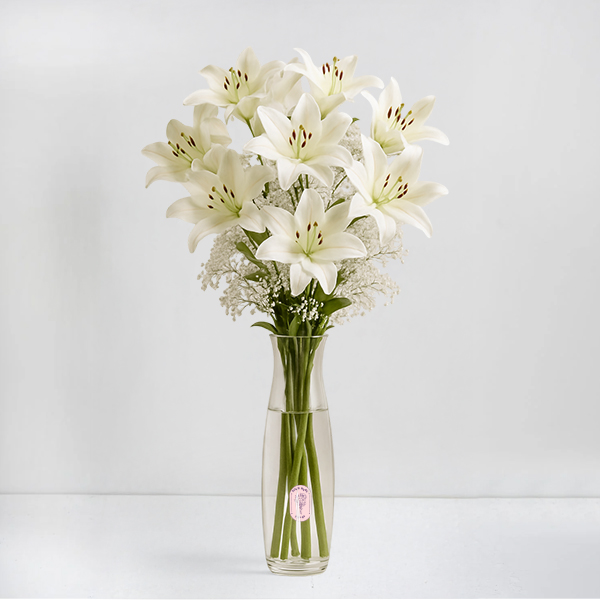 Elegant White Imported Lilies in a Glass Vase